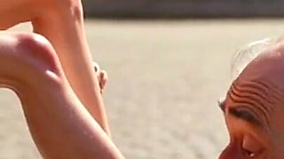 Submissive Man Worshipping Mistress Feet in Public Plaza