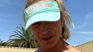 Blonde is flashing her big boobs in the outdoors