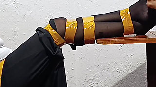 Tied with Plastic Tape Gagged with a Heel on the Face and Being Masturbated with a Toy