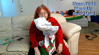 BBW Mature Redheaded Nurse Vicki Blows up Inflatable Snowman for You