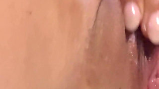 A Naughty Girl with Glasses Playing with Her Dildo