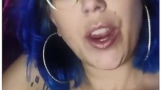 Close-up lips wrapped around a cigarette, smoke curling in the air
