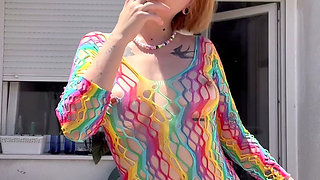 Smoking in a Rainbow Fishnet on the Balcony