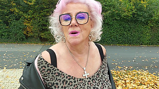 Naughty Granny Tongue Out Flashing Big Tits in Public