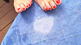 My neighbors cute red toes in the sun begging to be kissed and licked