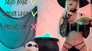 A blond doll in a witch hat and black with cum
