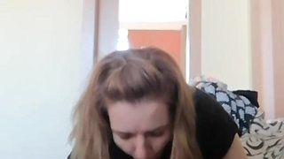 While he watches TV, I give him a blowjob