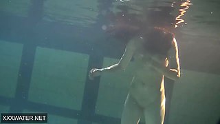 Shaved brunette sissy Irina Polcharova naked in the pool
