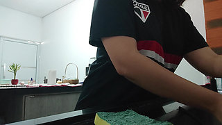 Woman teasing while washing dishes. She loves to transmit to the voyeurs on duty