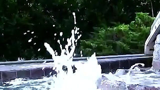 Two horny lesbians masturbate with toys outdoor by the pool