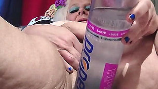 Big Bottle Plugged Clit Cunt