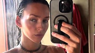 Bodacious brunette beauty posing naked in the shower