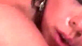 Stunning brunette babe is pleasuring two hard dicks