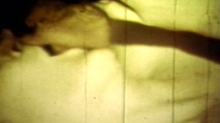 Worn Sepia Loop Captures Curly Retro Couple in Raw Bedroom Passion