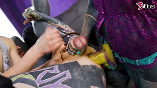 Inked submissive fellow double-pegged into submission by 2 relentless dommes