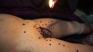 Mistress punishing his cock and body witn a wax