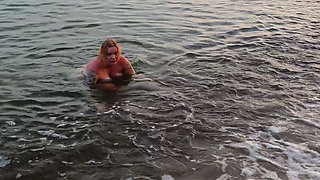 POV. You Watch as a Busty Model, of Your Presence, Strips Naked on the Beach, Bathes, and Plays in the Sand.