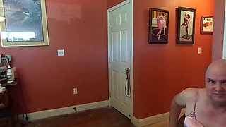 Crossdresser helps put on a corset for BBW