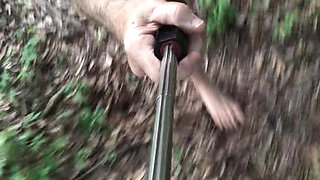 Behind my house in the woods walking around naked