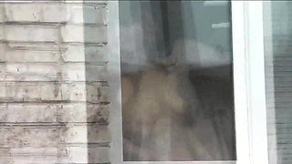 Naked in public. Random man taxi driver from car watches a naked woman washing apartment windows. Public nudity Naked woman  POV