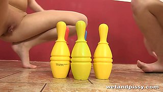 Teens have fun a game of bowling with piss