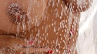 Sexy wife shows off tanned body in outdoor shower with soapy big natural tits and perfect pussy and ass