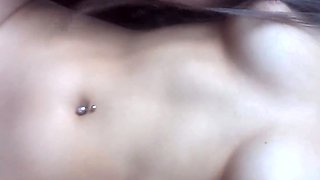 In broad daylight, she inserts a sex toy to pleasure