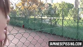 Risque Japanese babe peeing in bag and cup in the car