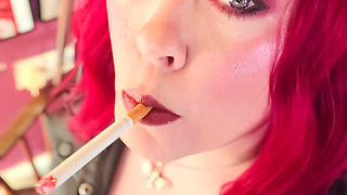 Your Mistress Tina Snua dressed In Leather Chain Smoking 2 Cork Cigarettes
