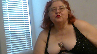 Mature BBW Redhead Nurse Vicki Talks to You as She Makes a Lipstick Applying Video for You!