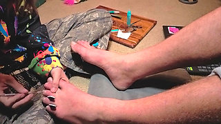 Praising her Masters' feet