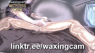 A Nurse in White Gloves Waxes a Guy