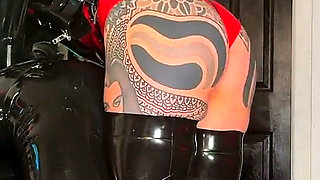 Intermediate Pegging: Two Latex Doms and the Brown Strap-on
