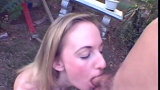 Young Blonde Gives Some Head to Her College Teacher Outdoors