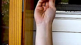 Shaved Head Goth Smokes Outside