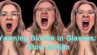 Yawning Blonde with Glasses in Slow Motion