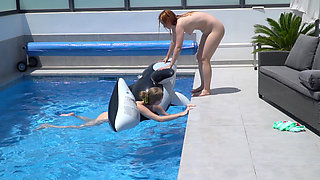 Lesbian Girls Are Having Fun in a Pool with an Inflatable Shark