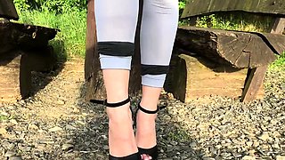 Brunette enjoys foot fetish outdoor