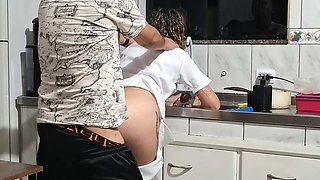 Banging the maid from behind in the kitchen.