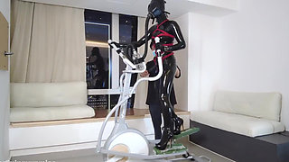 Mz27 - a Girl Bound in Latex Walks on a Treadmill